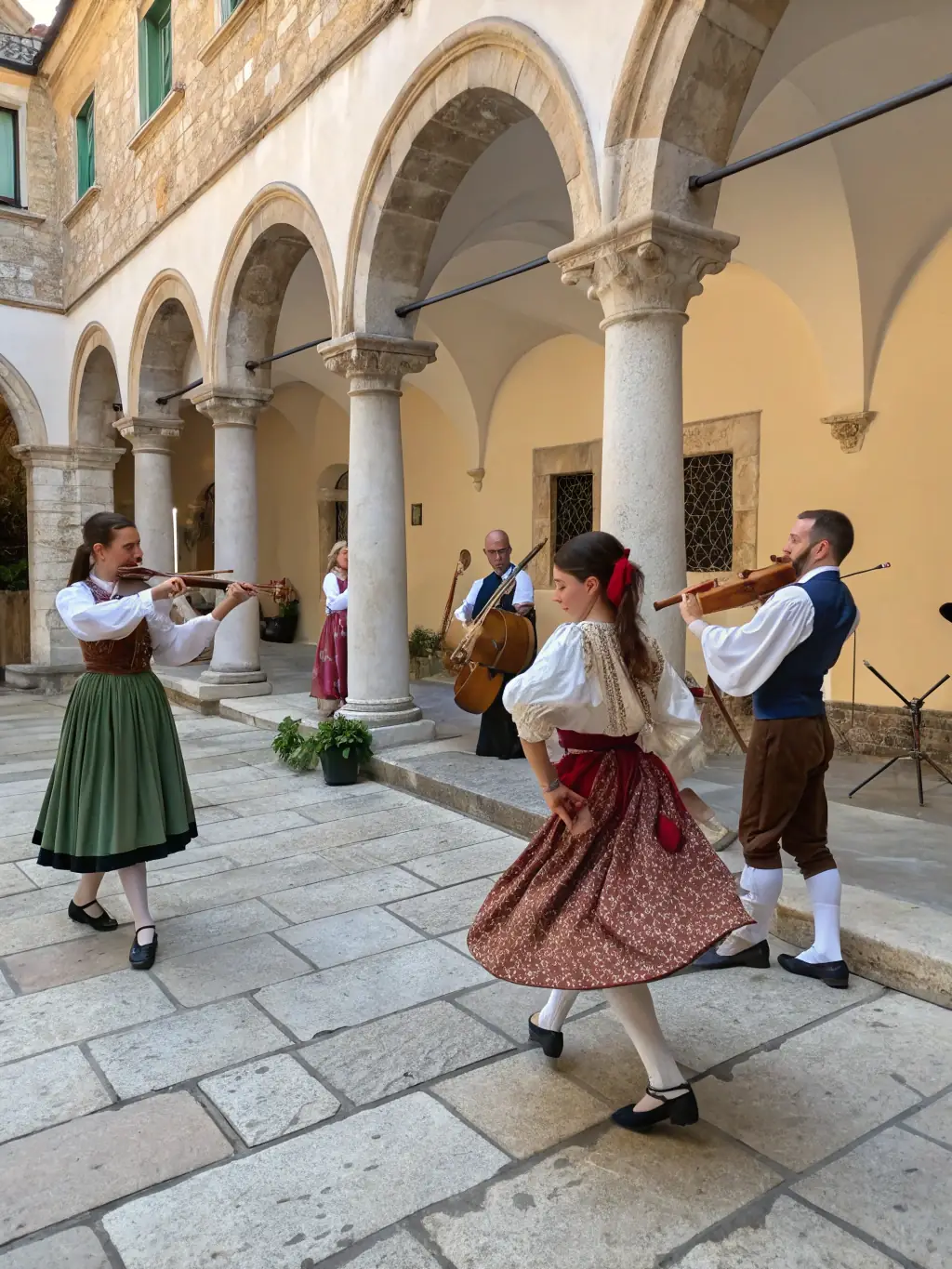 A lively image of a local cultural festival organized by LES AMIS DU CHATEAU D'AUROUZE, featuring traditional music, dance, and local crafts.